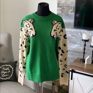 Green sweater with leopards